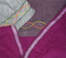 Embroidery and tablet weave on the hems of clothes