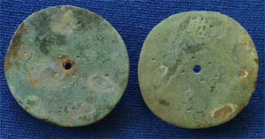 Disc brooches